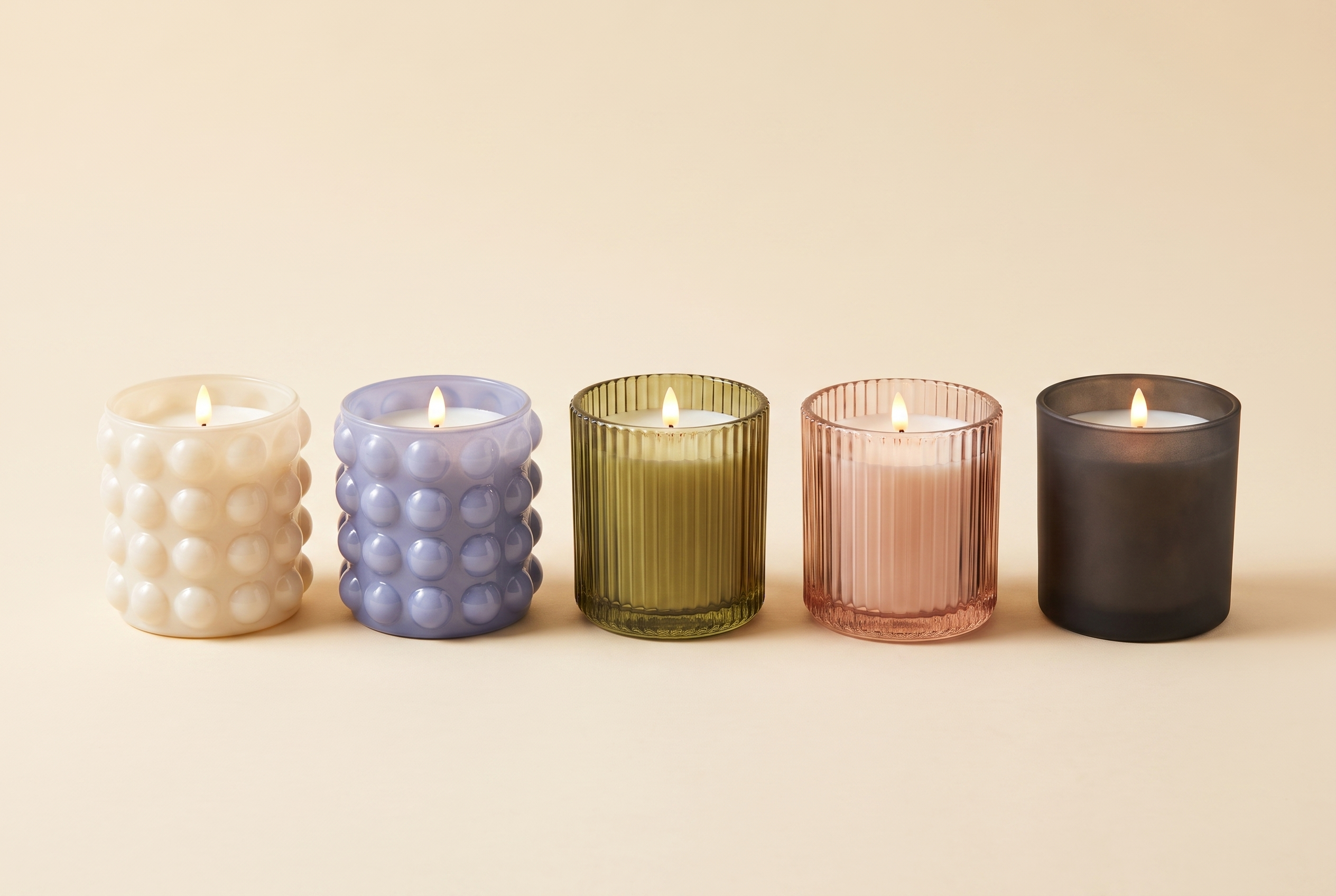 Emberless flameless candle diffuser in all five finishes: cream bubble, periwinkle, olive ribbed, pink ribbed, frosted charcoal