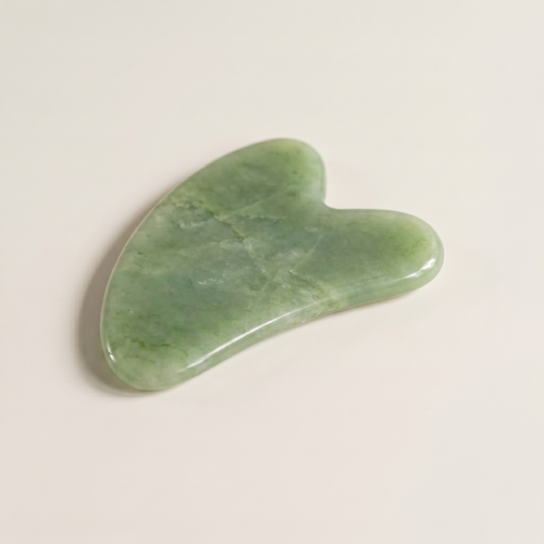 Green jade gua sha sculpting stone